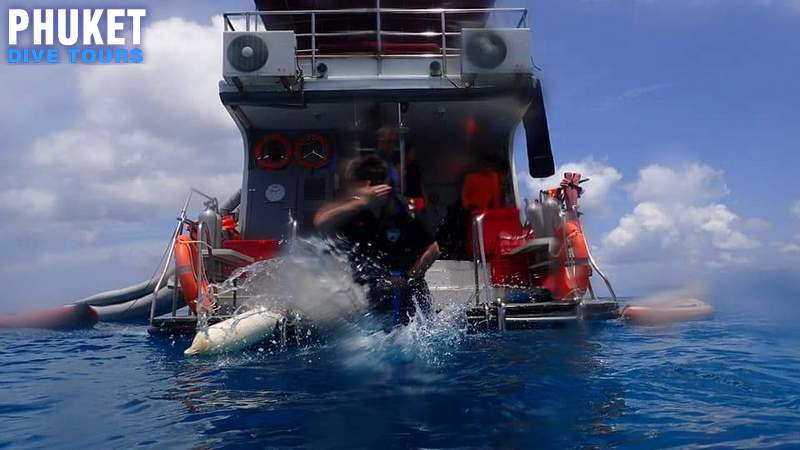 open water diver entering the water